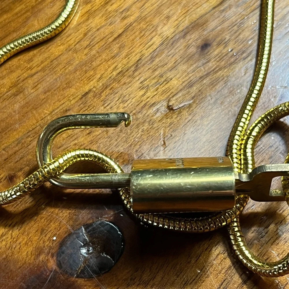 Louis Vuitton Gold Lock On off brand chain No 305 Works. Authentic